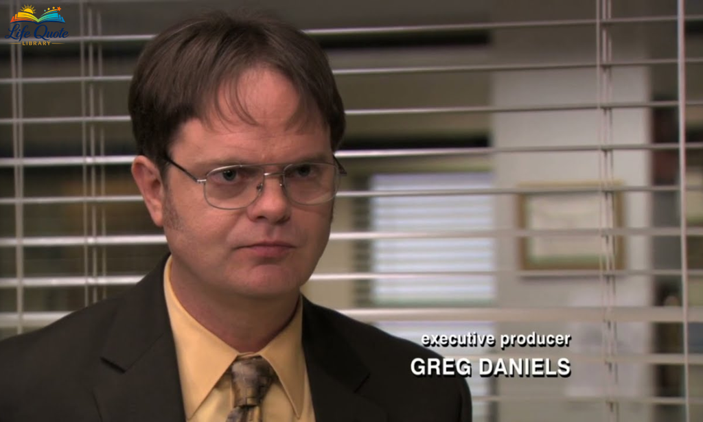 Dwight Schrute looking serious at the office desk in The Office