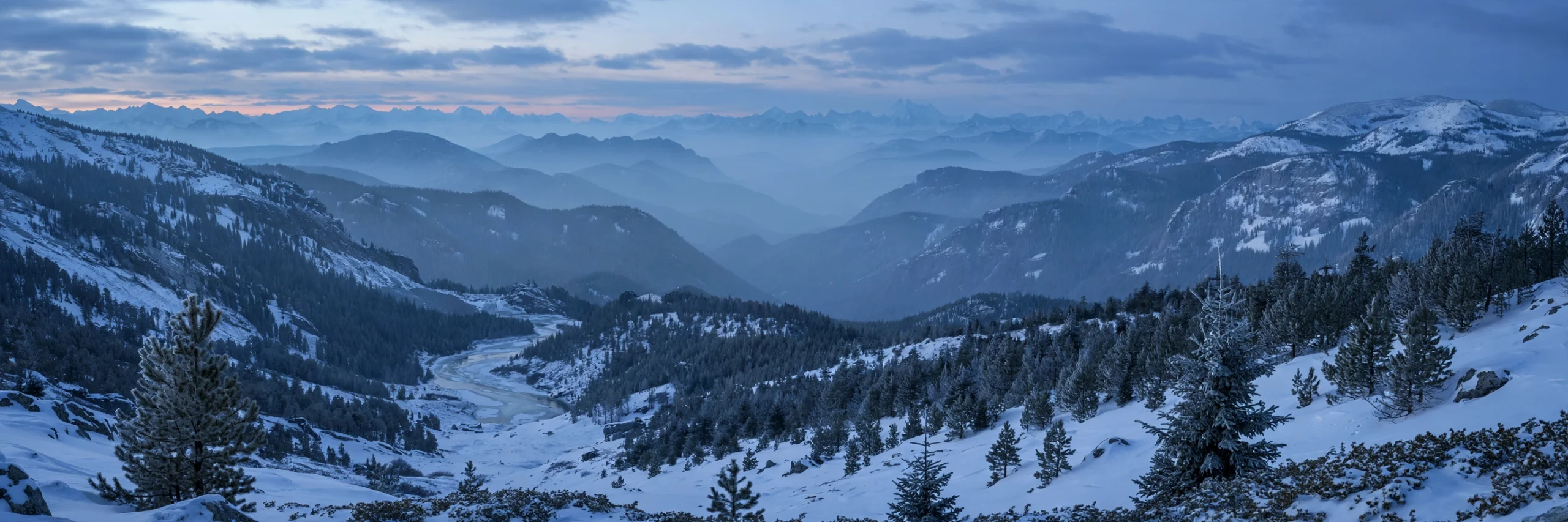 Snowy mountain valley panorama at dusk — mountain quotes